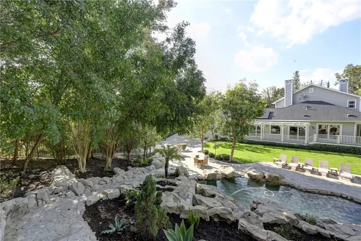 On the left side of this photo is the walkway up to the pool slide. Such a great view of the backyard too.