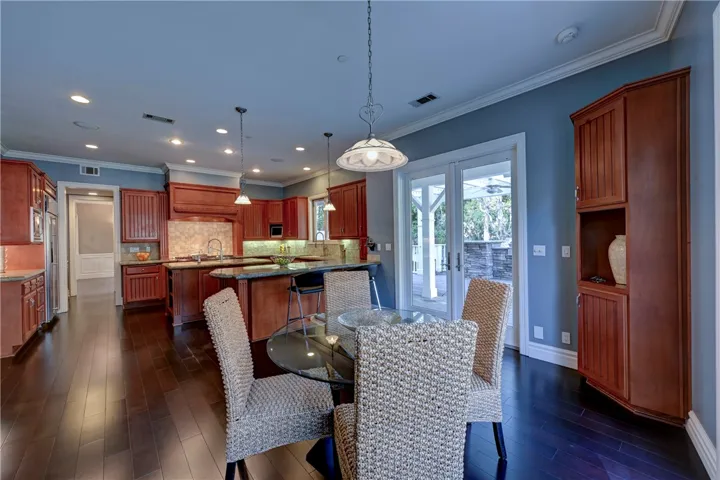 Kitchen eating nook with views to the back and side yards as well as the family/game room.