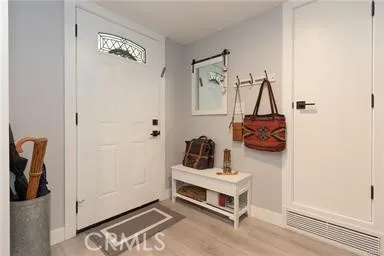 Inside entrance with "wood-like" soft gray flooring