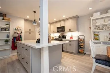 View of center island with cabinets and large pull out drawers for pots and pans