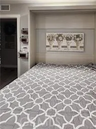 Secondary bedroom with built-in "Murphy" bed opened to the room. Close it up and you can have an office too!