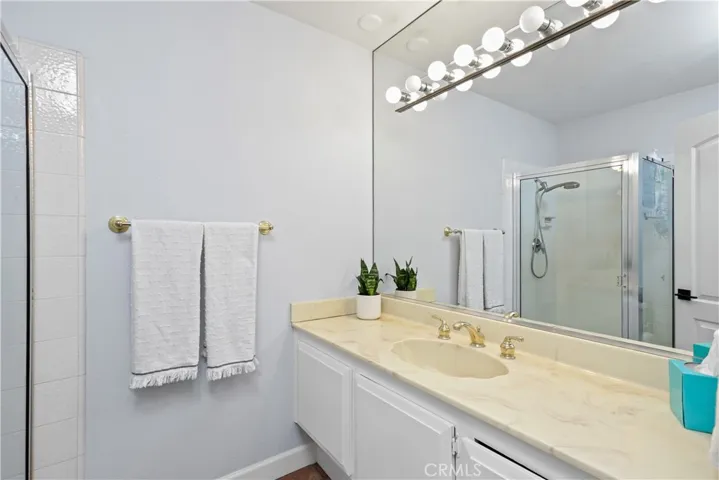 Full bathroom with walk in shower on the downstairs level.