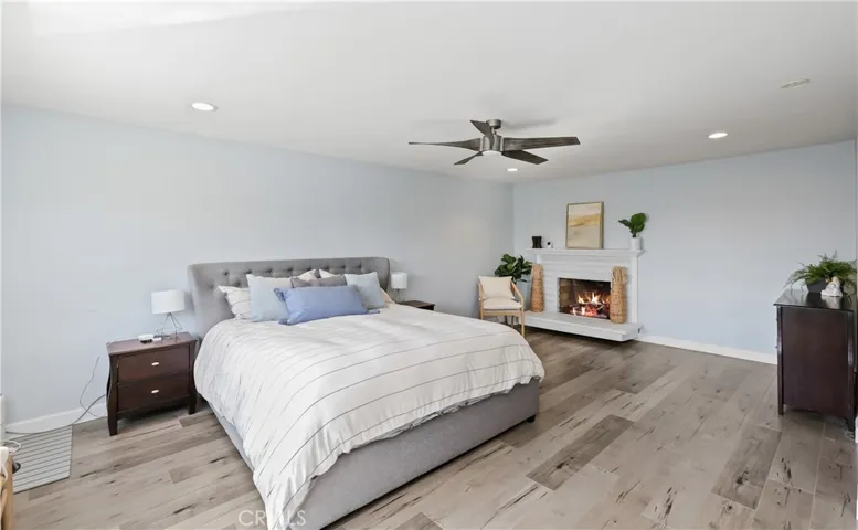 Spacious primary room with fireplace.