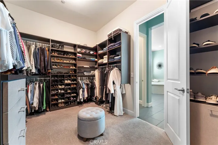 Primary oversized custom closet off from large en suite.