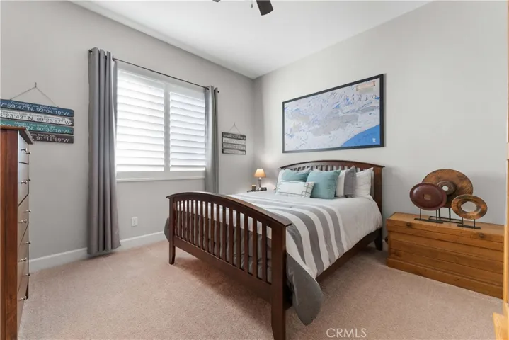 One of four bedrooms with ceiling fan.