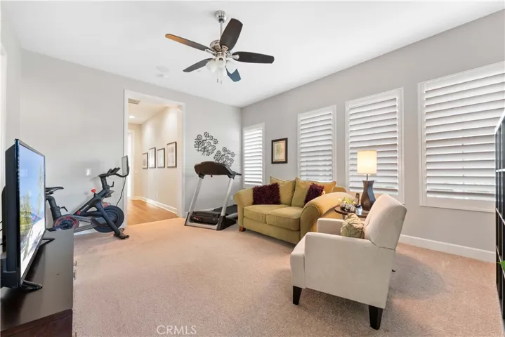 Bonus living area among three out of four bedrooms. Currently used as a workout area and TV den.
