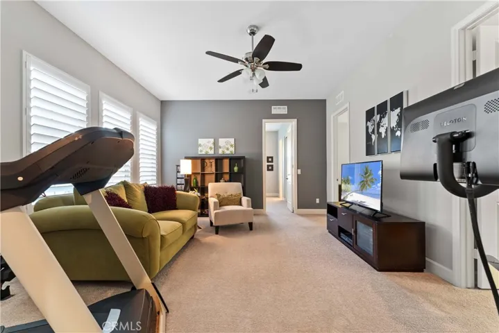 Bonus living area among three out of four bedrooms. Currently used as a workout area and TV den.
