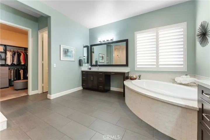 Beautiful en suite with separate shower and soaking tub and two sinks, private commode  and oversized custom closet.