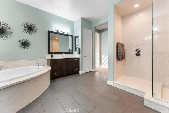 Beautiful en suite with separate shower and soaking tub and two sinks, private commode  and oversized custom closet.