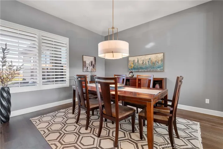 Elegant dining room with window view of he front.