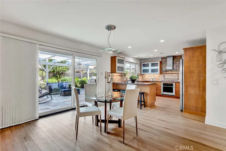 Breakfast Room and Remodeled Kitchen with Sliders Leading to Park-Like Backyard
