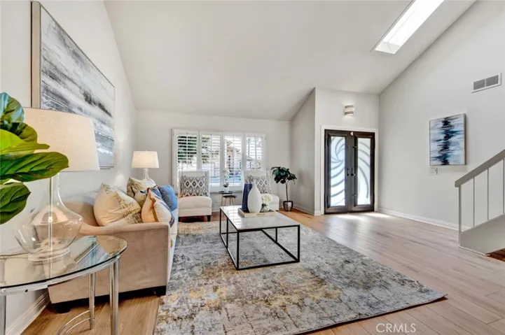 Brand New Wood Vinyl Flooring, Dual Pane Windows, Plantation Shutters, Skylight, and Soaring Ceiling