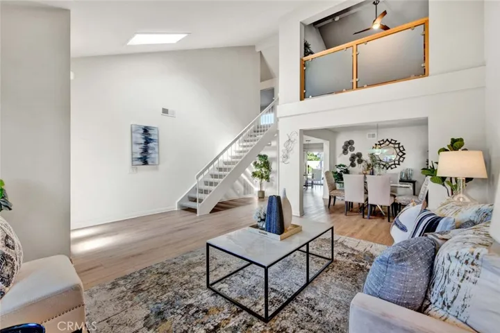 Formal Living Room, Dining Room, Staircase to 2nd Floor. 4th Bedroom Upstairs Overlooks this Living Room with Frosted Glass Pony Wall is Currently an Office but can be Enclosed in as Bedroom