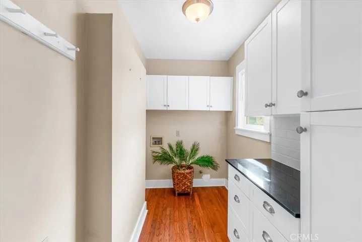 Nicely updated Laundry room w/updated cabinets for extra storage.