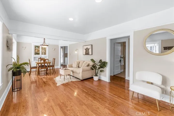 Charming Living and dining room. Check out the beautiful hardwood floors!