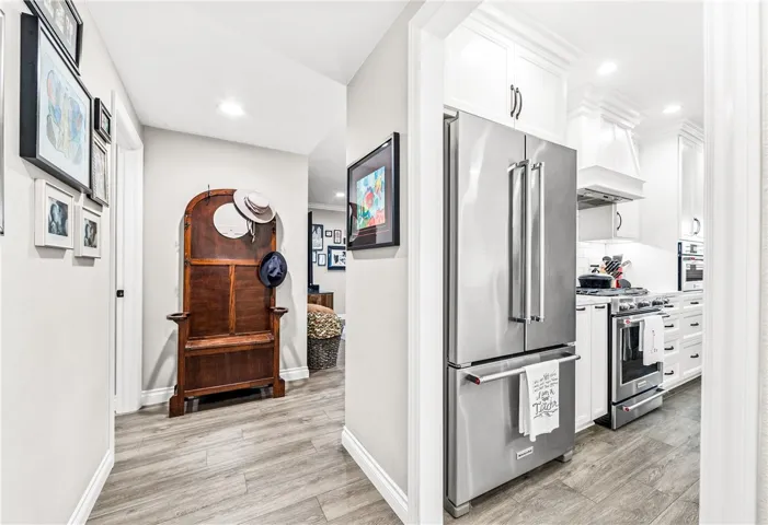 Lets go inside, lovely foyer with kitchen entrance to the right. Large storage on the left.