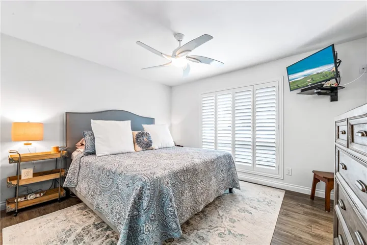 Primary Bedroom, that's a king size bed! Wonderful floor to ceiling window which looks to the private courtyard. Great morning light.