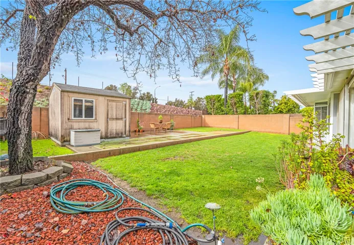 Another view of the very large backyard.  Complete with shuffleboard court and storage shed...I'm thinking kids playhouse or how about a She Shed! The bones are there!