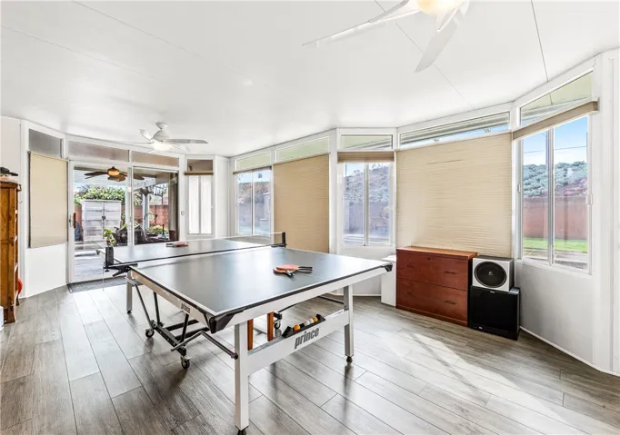 Approximately 300+sq. ft.  additional living space, great lighting, AC, and direct access to the backyard. Currently the game room-how will you use this space?