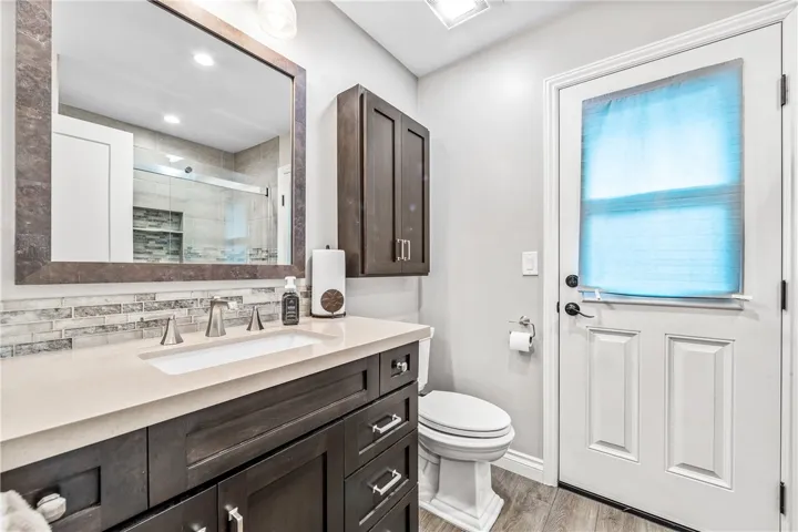 Main bathroom view with access to the side yard.