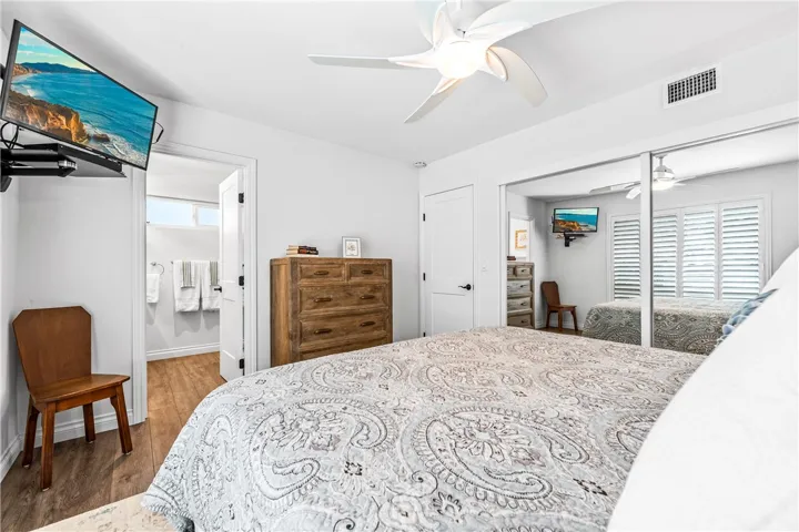 View from far side of room to the door and private bath to the left.