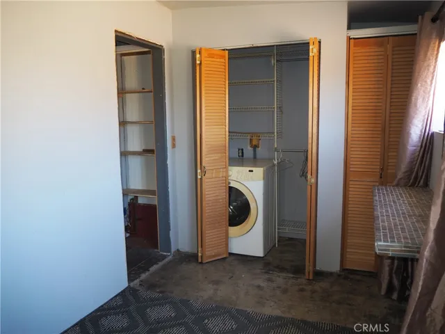 Laundry area and built-in shelf on the right.