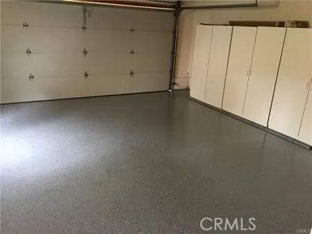 Garage with epoxy floor and storage cabinest
