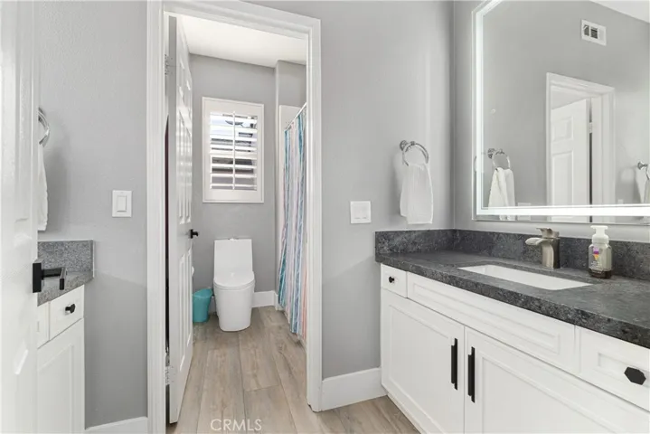 Central full bathroom has new counter tops, and dual sinks.