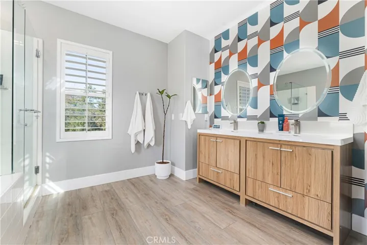En-suite has a new dual sink vanity, custom wall, new flooring, separate shower, soaking garden bathtub.