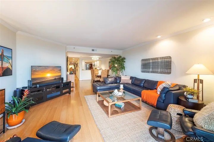 View of living room, dining room, kitchen and hallway