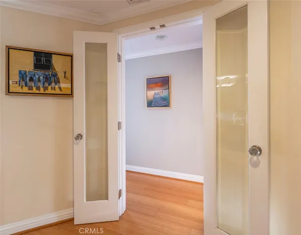 Glass French door entry to Primary Ensuite