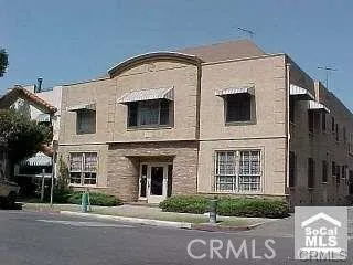Older picture of the building before the trees grew!