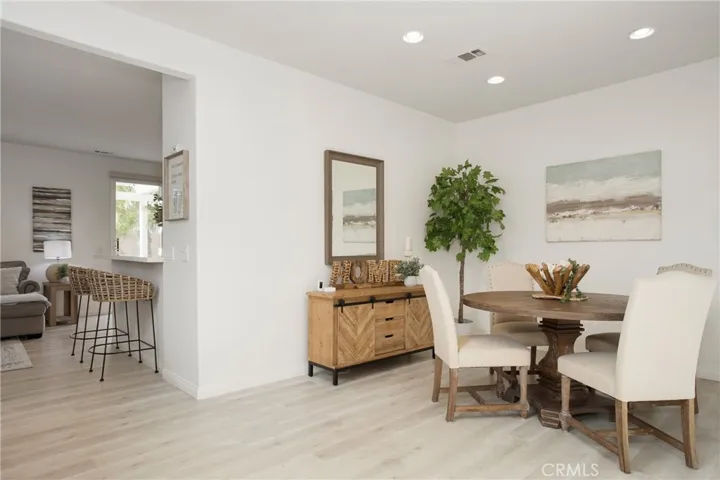 Dining room with view into kitchen area