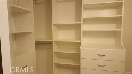 Walk-in Closet in Primary Bedroom with California Closet Builtins