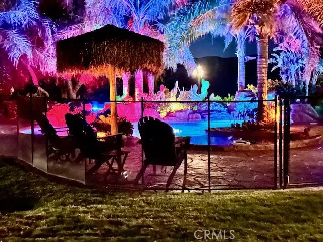 Pool area at night with many lighting choices