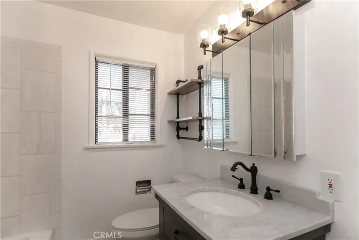 Main Bath has quartz floor, new lights, new shelf, new sink & new vanity