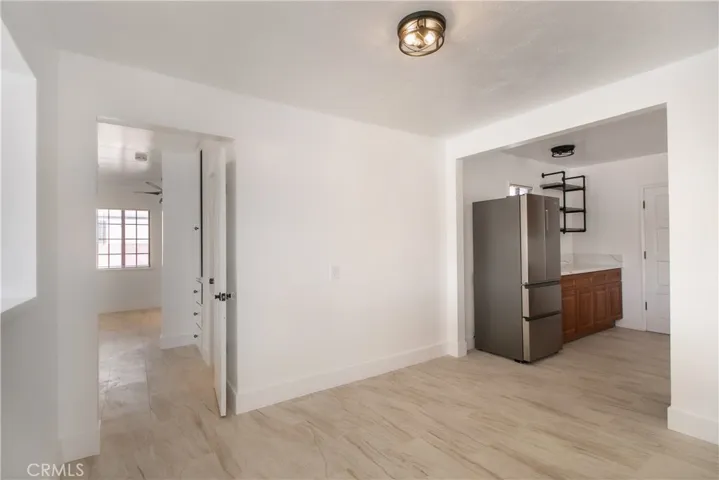 Spacious Dining area is behind the pony wall divider