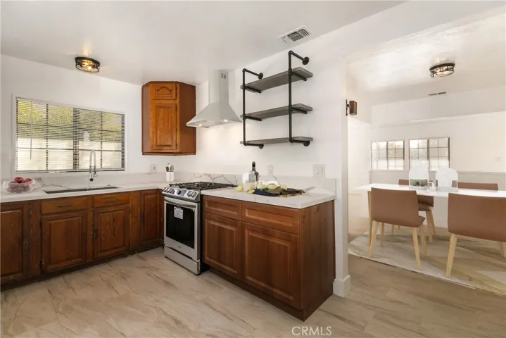 Updated kitchen with new stove & hood opens to convenient Dining room