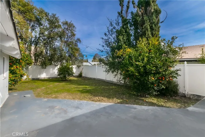 Rear patio overlooks huge backyard