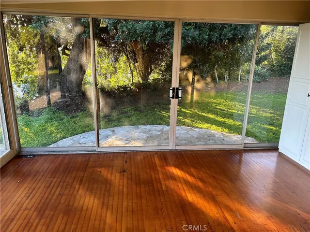 view of side yard from den