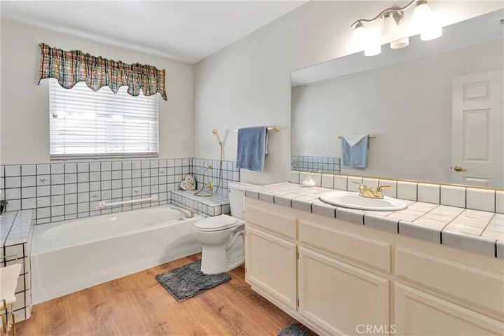 Customize bathroom with new vinyl flooring.