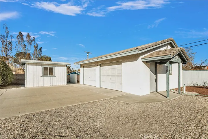 Garage and extra shed for lots of storage.