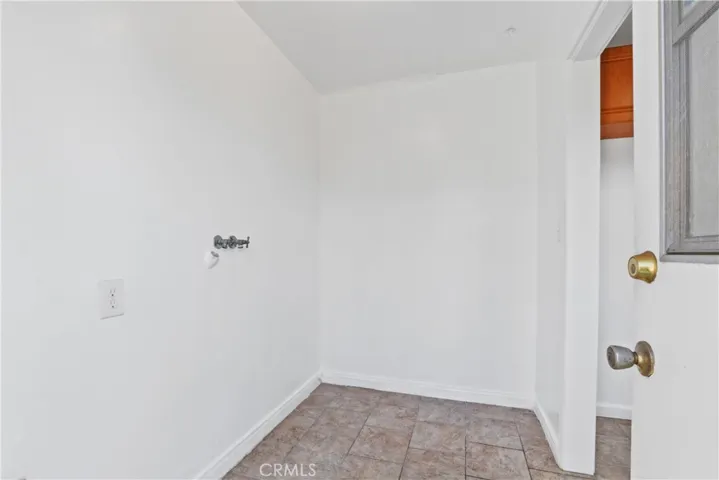 Washer and dryer hookups next to kitchen