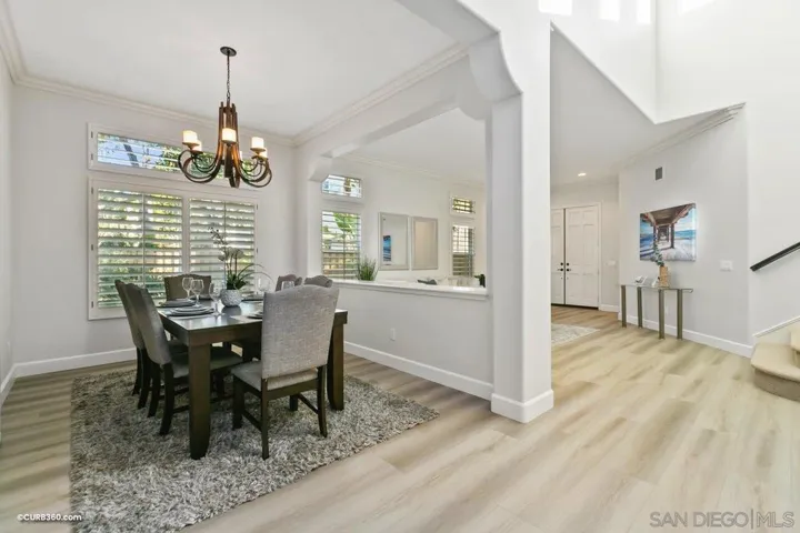 Bright formal dining room opens to the formal living area