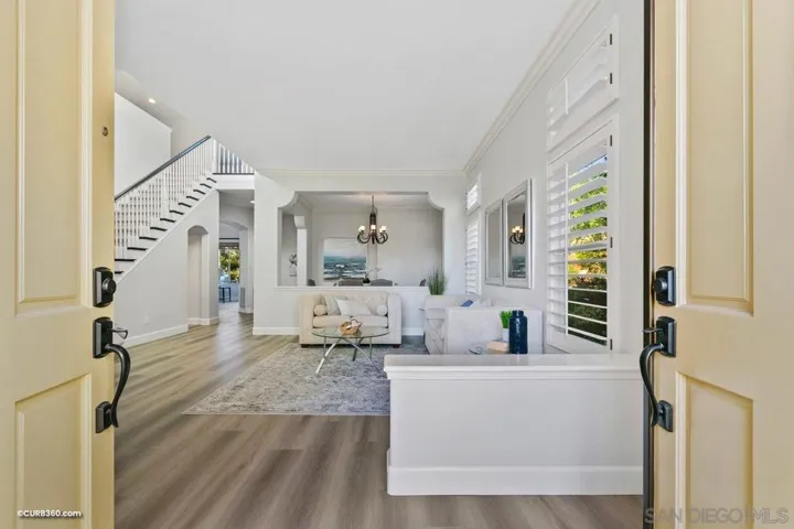 Inviting double door entry into the luxurious foyer and formal dining area of your dream home!