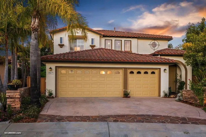 Exceptional curb appeal with a plenteous paved laden driveway, 3-car garage and plush mature landscaping