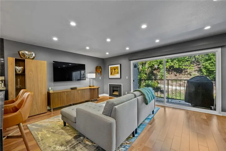 Large Living Room with serene views of the surrounding manicured HOA grounds!