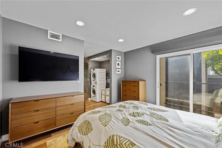Laundry Closet with Miele Stackable Washer and Condenser Dryer is right off the Bedroom and Bathroom.