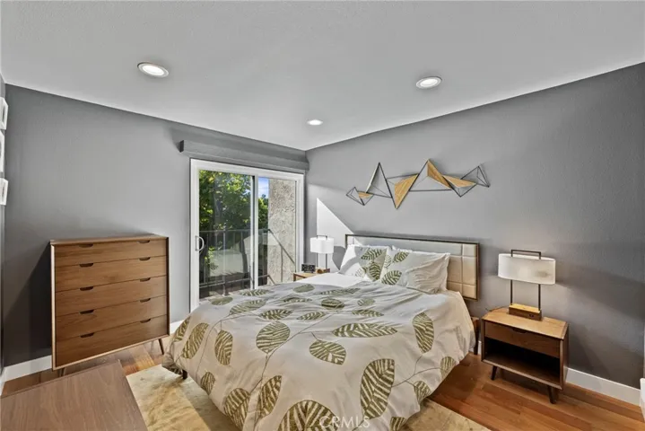 Large Bedroom with Sliding Glass Door that opens to a Juliet Balcony.
