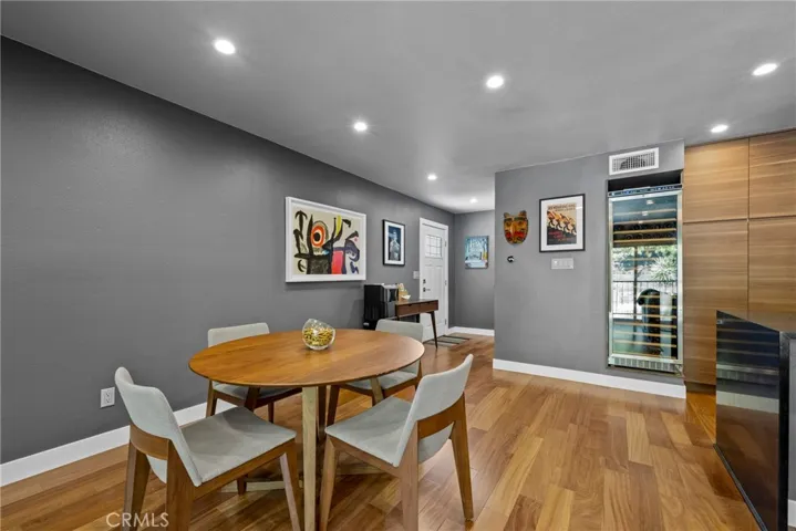 Dining Room area with views of the Entry and the 158 Bottle Dual Zoned Wine Refrigerator!